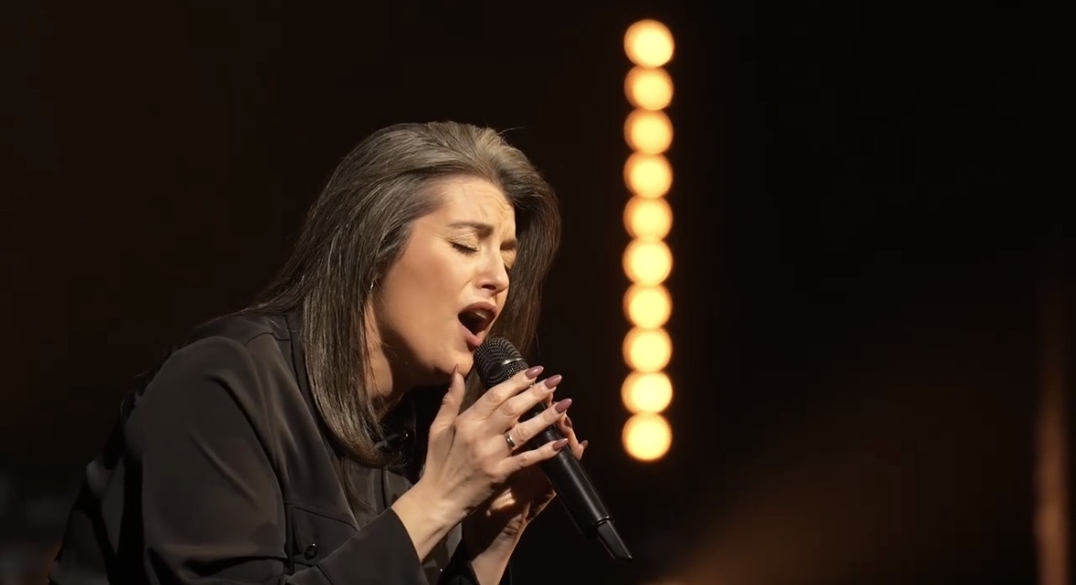Singer performing into a microphone